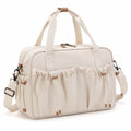 Sac de voyage 42 x 20 x 30 cm en textile écru avec bandoulière réglable et poches extérieures